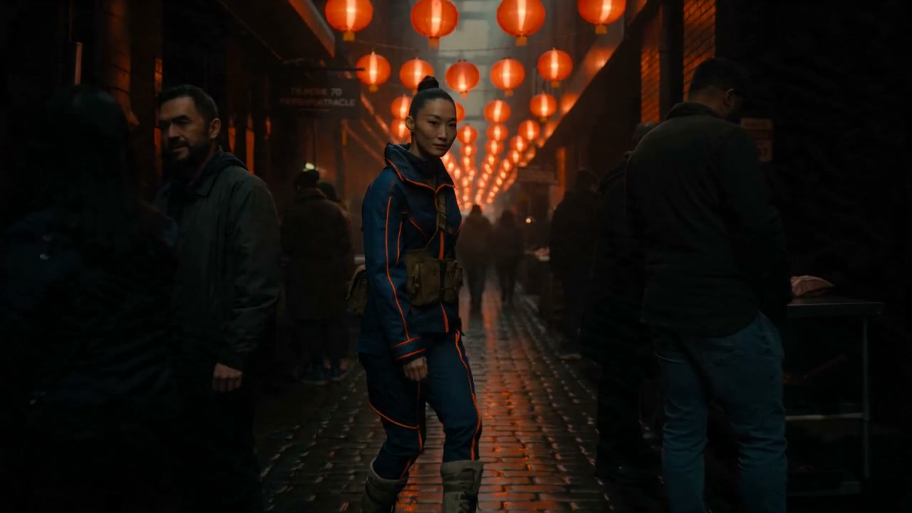 A figure passes through the narrow lantern-lit market crowd. Supplied generated shot study.
